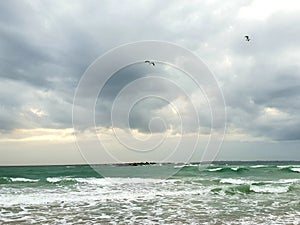Stormy clouds over the sea, photographed at Bloubergstrand, South Africa photo