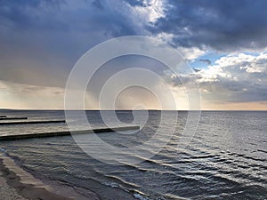 Stormy clouds sky over Baltic Sea coast at dusk