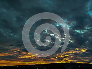 Stormy Clouds at sunset with communication tower