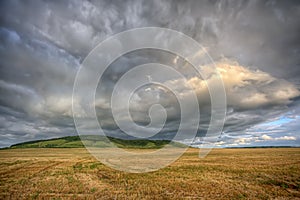 Stormy cloudscape over the summer field