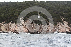 Stormy cloudy day. Dramatic sky and huge waves at the Lighthouse