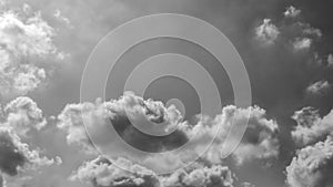 Stormy dark cloudy sky. Black and white fluffy clouds in the sky.