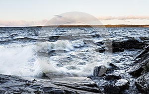 Stormy day next to lake in December in Finland