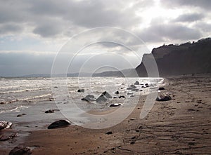Stormy day at Smugglers Beach in Devon, UK