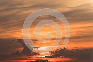 Stormy dramatic sky background with yellow red and orange clouds. Sunset skyline. Storm on the beach.