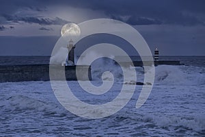 Stormy full moon night at river mouth