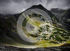 Stormy landscape in Retezat Mountains over the peaks and glacier lakes