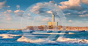 Stormy morning view of lighthouse in Vieste town. Fantastic spring sunrise on Adriatic sea, Gargano National Park, Apulia region,