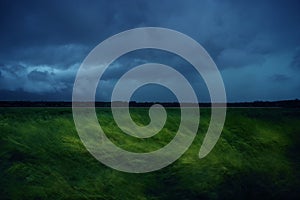 Green wheat field with stormy rainy dark clouds over the Western Plain of Romania.