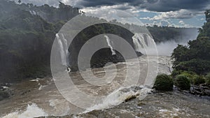 A stormy river rushes through the gorge. Iguazu Falls.