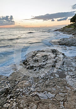 Stormy rocky beach sunset on the coast of Adriatic Sea