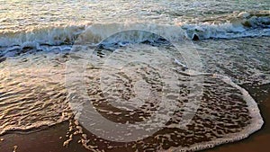 Stormy sea Big waves white foam sea against backdrop sunset and dawn Slow motion