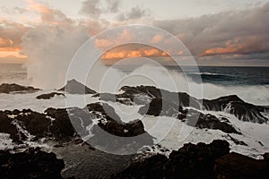 Stormy sea and a lot of rocks under the cloudy sky