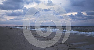 A stormy sea and a man on the shore