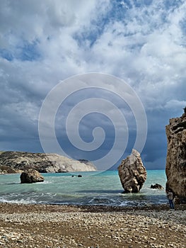 Stormy sea and mistical rock photo