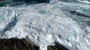 Stormy sea waves near a rocky shore