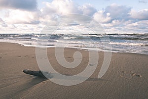 Stormy sea in winter with white waves crushing - vintage film lo