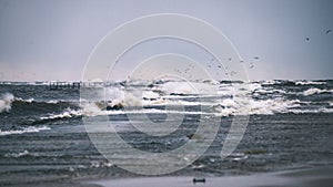 Stormy sea in winter with white waves crushing - vintage film lo