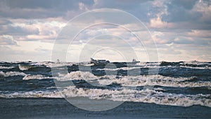 Stormy sea in winter with white waves crushing - vintage film lo