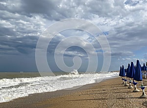 Stormy Seascape with Closed Umbrellas