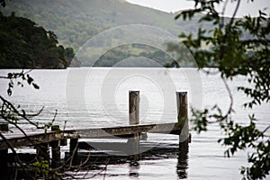 Stormy skies and jetty north east across ullswater from glenridding