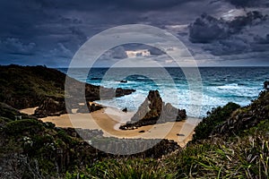 Stormy skies over coastal landscape with impressive sea stacks