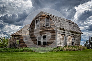 Stormy skies over an old, abandoned home in Saskatchewan