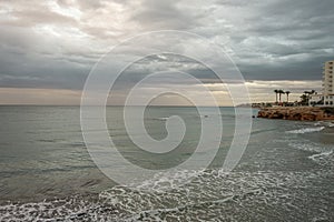 Stormy sky on La Zenia beach in Alicante. Spain photo