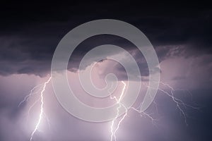 Stormy sky with lightning strikes and thunderstorm clouds