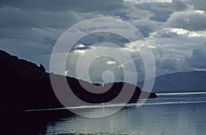 Stormy sky over mountains and lake