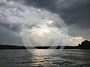 Stormy sky over the river in summer