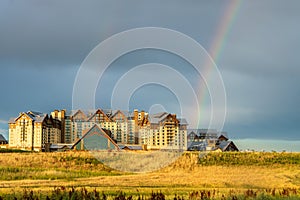 The stormy sky and rainbow above the new Gaylord Rockies Resort and Convention Center in Denver