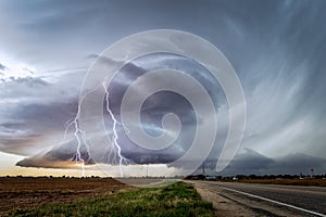 Stormy sky with supercell thunderstorm and lightning bolts