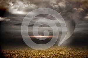 Stormy sky with tornado over field