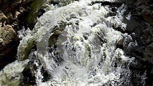 Stormy stream of water in Ukrainian Carpathians at the Probiy waterfall. Crystal pure water