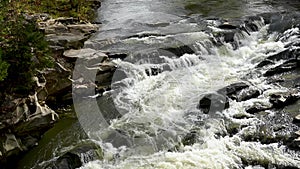 Stormy stream of water in Ukrainian Carpathians at the Probiy waterfall. Crystal pure water