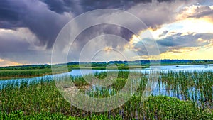 stormy sunset sky in Alabama swamp landscape in summer