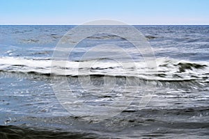 Stormy waves of the Baltic sea. Seascape with waves blurred by long exposure.