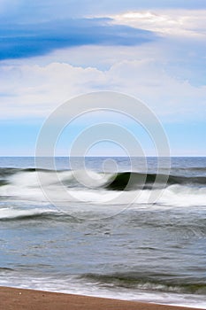 Stormy waves of the Baltic sea. Seascape with waves blurred by long exposure.