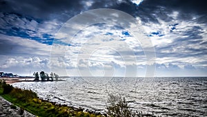 Stormy weather and dark clouds over het IJsselmeer in the Netherlands