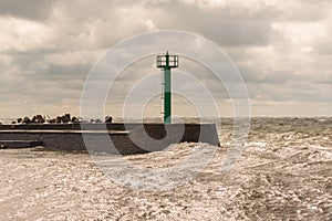 Stormy weather at sea. Stormy waves entering the harbor