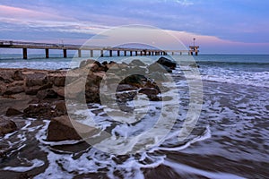 Stormy winter Black Sea landscape in Burgas bay, Bulgaria. Blue hour sunset