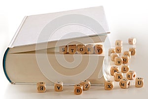 Story - message with wooden letter blocks in a book