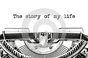The story of my life is typed on a blank sheet of paper with an old typewriter.