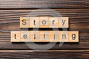 Story telling word written on wood block. Story telling text on wooden table for your desing, Top view concept