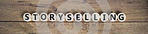 Storyselling symbol. Wooden small wooden circles with word 'storyselling'