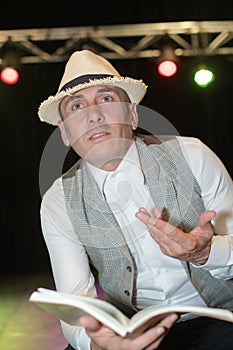 Storyteller performing on stage photo