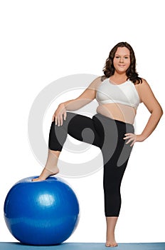 Stout woman with blue ball fitness