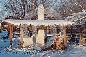 Stove under a canopy in winter