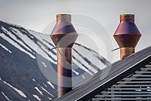 Stovepipe chimneys on top of roof in Longyearbyen, Norway